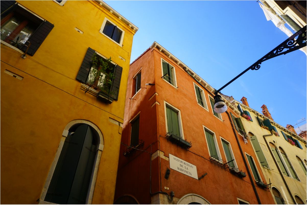 Colorful buildings accompany you as you walk in Venice
